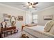 Cozy bedroom with a wooden bed, dresser, and artwork on the walls at 9277 Sw 70Th Loop, Ocala, FL 34481