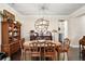 Formal dining room with wooden table and chairs, a large clock, and built in hutch at 9277 Sw 70Th Loop, Ocala, FL 34481