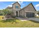 Stunning curb appeal with stone facade and well-manicured lawn at 9277 Sw 70Th Loop, Ocala, FL 34481