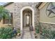 Elegant front entry with stonework and a charming walkway at 9277 Sw 70Th Loop, Ocala, FL 34481