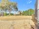 Spacious backyard with gravel pathway and mature trees at 9397 Se 124Th Pl, Summerfield, FL 34491