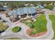 Aerial view of clubhouse with patio and landscaping at 9397 Se 124Th Pl, Summerfield, FL 34491