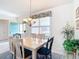 Dining room with chandelier and view of living room at 9397 Se 124Th Pl, Summerfield, FL 34491