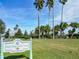 Sign for Eagle Ridge Golf Course with palm trees at 9397 Se 124Th Pl, Summerfield, FL 34491