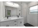 Modern bathroom with double vanity and walk-in shower at 1 Malauka Pass Ct, Ocklawaha, FL 32179