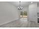 Bright dining area with sliding glass doors leading to the backyard at 1 Malauka Pass Ct, Ocklawaha, FL 32179