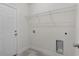 Laundry room with built-in shelving and hookups at 1 Malauka Pass Ct, Ocklawaha, FL 32179