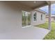 Covered patio with sliding glass door access at 1 Malauka Pass Ct, Ocklawaha, FL 32179