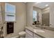 Bathroom featuring a vanity with a sink, a mirror, and a toilet at 10161 Spring Lake Dr, Clermont, FL 34711