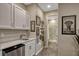 This bonus room features a wet bar area and leads to the full bathroom with a glass door shower at 10161 Spring Lake Dr, Clermont, FL 34711