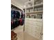 Walk-in closet featuring built-in shelves and drawers at 10161 Spring Lake Dr, Clermont, FL 34711