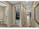 Hallway with wood-look tile flooring leading to the bathroom, office and the rest of the home at 10161 Spring Lake Dr, Clermont, FL 34711