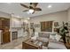 This living room features neutral paint and an adjoining kitchenette, providing a cohesive living space at 10161 Spring Lake Dr, Clermont, FL 34711