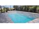 Inviting pool area with spa and screened enclosure at 10161 Spring Lake Dr, Clermont, FL 34711