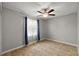 Well-lit bedroom with ceiling fan and window treatments at 10830 Anna Belle Ave, Leesburg, FL 34788