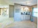 View of dining room and kitchen, featuring cabinets with a display cabinet and adjacent breakfast nook at 1204 Maria Ct, Lady Lake, FL 32159