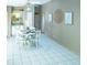 Dining room featuring a ceiling fan, white round table set and tile flooring at 1204 Maria Ct, Lady Lake, FL 32159