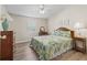 Comfortable guest bedroom with a queen bed, dresser and nightstands at 1210 Tarpon Ln, The Villages, FL 32159