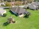 Aerial view of the home showcasing the meticulously maintained lawns and landscaping at 12886 Se 97Th Terrace Rd, Summerfield, FL 34491