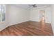 Bedroom featuring hardwood floors, natural light, and a ceiling fan at 12886 Se 97Th Terrace Rd, Summerfield, FL 34491