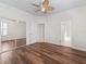 Large bedroom features wood-look floors, and walk-in closet at 12886 Se 97Th Terrace Rd, Summerfield, FL 34491