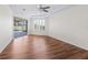 Bedroom featuring hardwood floors, natural light, and a ceiling fan at 12886 Se 97Th Terrace Rd, Summerfield, FL 34491