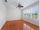 Bedroom featuring hardwood floors, natural light, and a ceiling fan at 12886 Se 97Th Terrace Rd, Summerfield, FL 34491