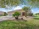 Beautiful home exterior featuring lush landscaping and a meticulously maintained yard at 12886 Se 97Th Terrace Rd, Summerfield, FL 34491