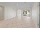 Bright living room with tile floors and sliding doors to the outdoor space at 12886 Se 97Th Terrace Rd, Summerfield, FL 34491