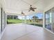 Screened-in lanai with serene views of the golf course at 12886 Se 97Th Terrace Rd, Summerfield, FL 34491