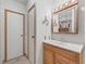 Bathroom with wood vanity and mirror at 1303 E Schwartz Blvd, The Villages, FL 32159