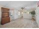 Bright living room with wood cabinet and carpet at 1303 E Schwartz Blvd, The Villages, FL 32159