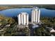 Two elegant high-rise condo buildings overlooking a lake at 13415 Blue Heron Beach Dr # 1501, Orlando, FL 32821