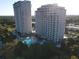 Two high-rise buildings with pool and lush surroundings at 13415 Blue Heron Beach Dr # 1501, Orlando, FL 32821