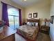 King bedroom with balcony access and city views at 13415 Blue Heron Beach Dr # 1501, Orlando, FL 32821