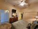 Spacious bedroom with dresser, tv, and large closet at 13415 Blue Heron Beach Dr # 1501, Orlando, FL 32821