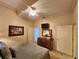 Spacious bedroom with a ceiling fan and en-suite bathroom access at 13415 Blue Heron Beach Dr # 1501, Orlando, FL 32821