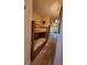 Long hallway with carpet and a bunk bed at 13415 Blue Heron Beach Dr # 1501, Orlando, FL 32821