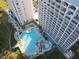 Aerial view of condo building and refreshing pool at 13415 Blue Heron Beach Dr # 1501, Orlando, FL 32821