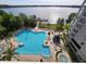 Resort-style pool and spa with lake view at 13415 Blue Heron Beach Dr # 1501, Orlando, FL 32821