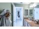 Bathroom featuring a vanity with a granite countertop and view of the hallway at 1541 Fenimore Ln, The Villages, FL 32162