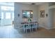 Light and airy dining room with a table set for six, bathed in natural light at 1541 Fenimore Ln, The Villages, FL 32162