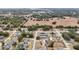 Aerial view of a neighborhood with a focus on one house at 15831 Se 89Th Ter, Summerfield, FL 34491