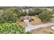 Aerial view showing a house on a tree-lined street at 15831 Se 89Th Ter, Summerfield, FL 34491