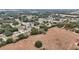 This wide shot shows the property's expansive location in a residential area with mature trees and open fields at 15831 Se 89Th Ter, Summerfield, FL 34491