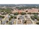 Aerial view of a neighborhood with a highlighted house at 15831 Se 89Th Ter, Summerfield, FL 34491