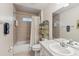 Bathroom with bathtub, shower, and vanity at 15831 Se 89Th Ter, Summerfield, FL 34491