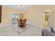 Dining area with wooden table and chairs near bathroom at 15831 Se 89Th Ter, Summerfield, FL 34491