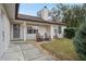 Inviting front entrance with rocking chairs and nicely landscaped yard at 15831 Se 89Th Ter, Summerfield, FL 34491