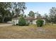 Single-story house with attached garage and driveway at 15831 Se 89Th Ter, Summerfield, FL 34491